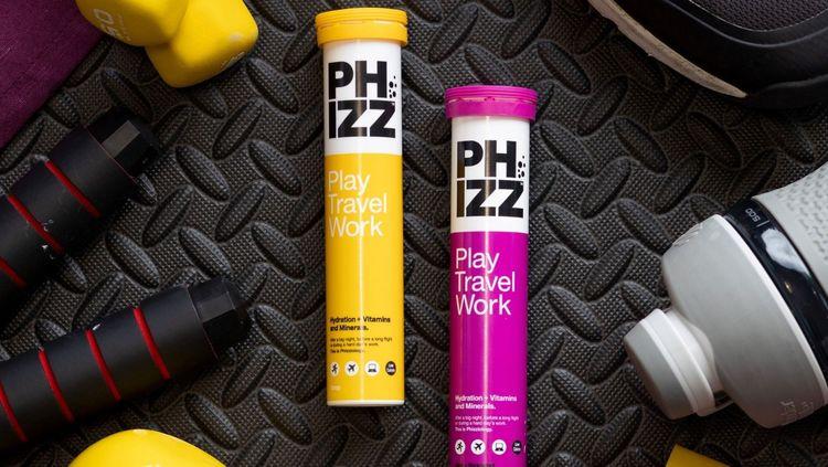 Two colourful plastic tubes of Phizz multivitamin tablets