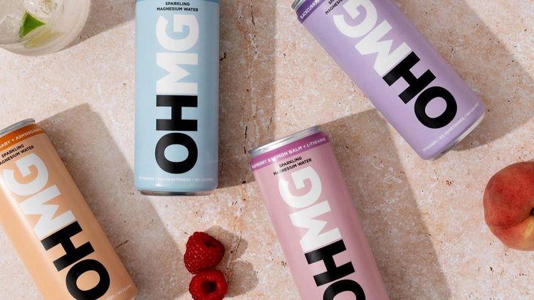 four brightly coloured cans of OHMG’s Magnesium Water