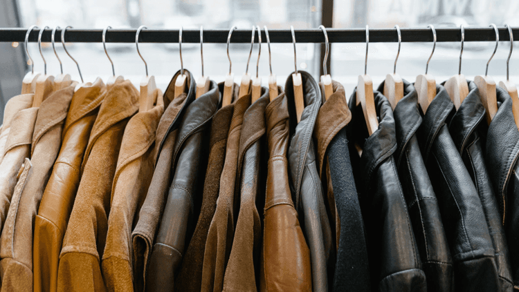 Second-hand leather jackets on a hanger in a vintage shop