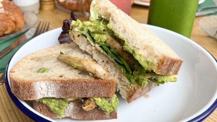 Vegan mushroom and avocado sourdough sandwich on a white plate from Perch & Co in Croxley Green