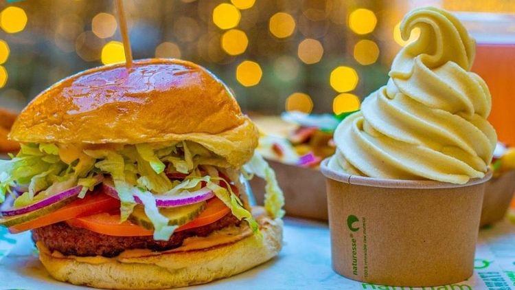 Vedang’s vegan burger next to vegan whipped ice cream 
