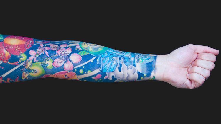 Multicoloured tattoo sleeve on a black background 
