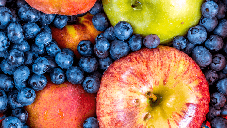 Close-up of vibrant blueberries and apples